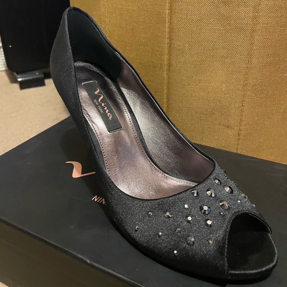 Black peep toe heels with dark rhinestone details